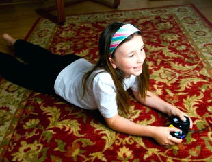 girl laying on area rug